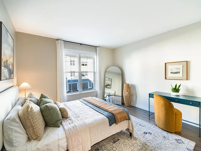 Space for a dedicated desk nook and natural light make this bedroom the perfect mix of rest, focus, or creativity at Modera South Shore.