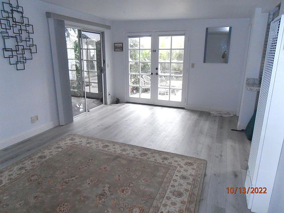 Living Room w/ French Doors open to Patio.