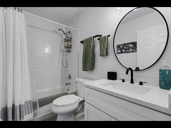 Full size bath (tub/shower), well lit, nice vanity space