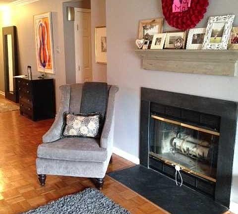 Living room with wood burning fire place