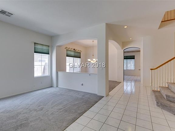 Formal living/dining room combo with new carpeting.