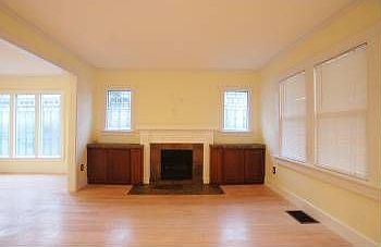 Living Room w/ Built in Cabinets surrounding Slate Fireplace