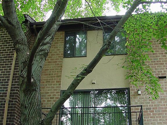 Rear of house with balcony off of living room
