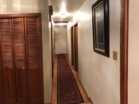 Hall way to 3 bedrooms