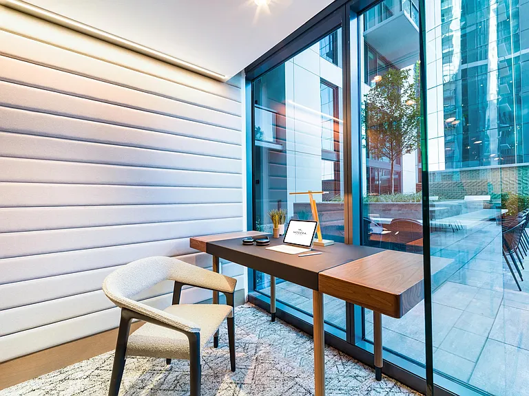A quiet work nook at Modera McGavock, offering natural light and a focused setting with Nashville's energy just beyond the doors.