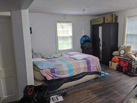 Armoire and trunk next to it remain. New blinds.
