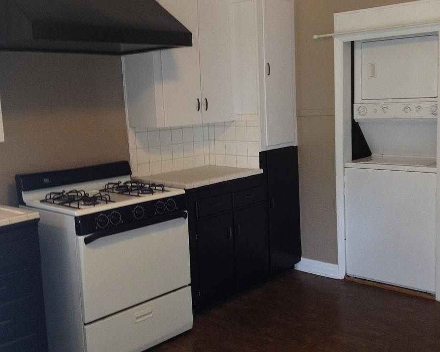 Kitchen with included washer dryer combo