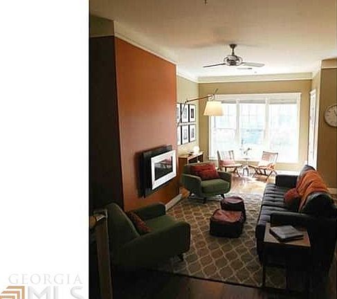 Large bright living space open to dining, office area, and with direct access to patio and courtyard