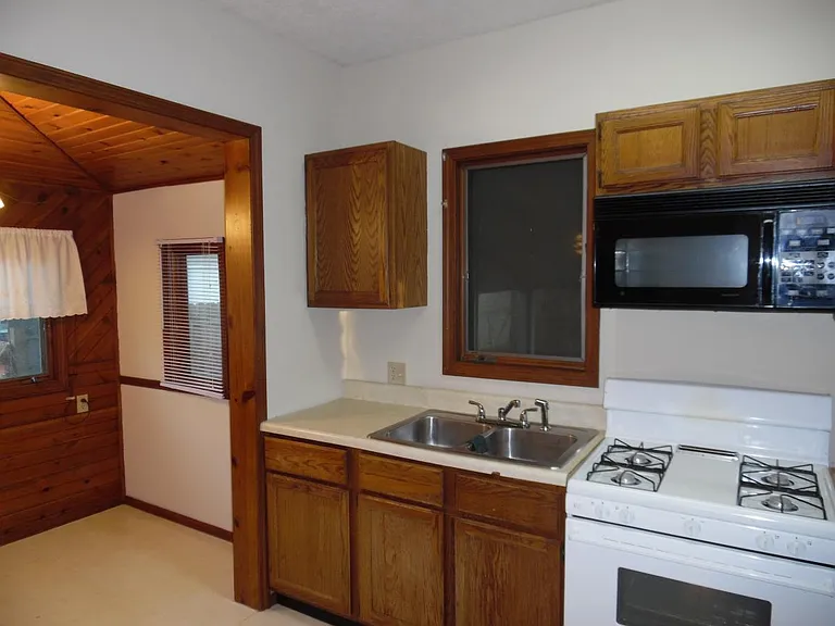 Kitchen has gas stove/oven, microwave and refrigerator furnished.