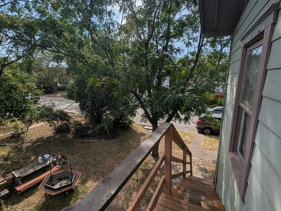 Upstairs entrance. Street on the West side is Tom Green.