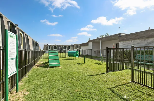 Expansive fenced pet park and open lawns designed for your furry friends.