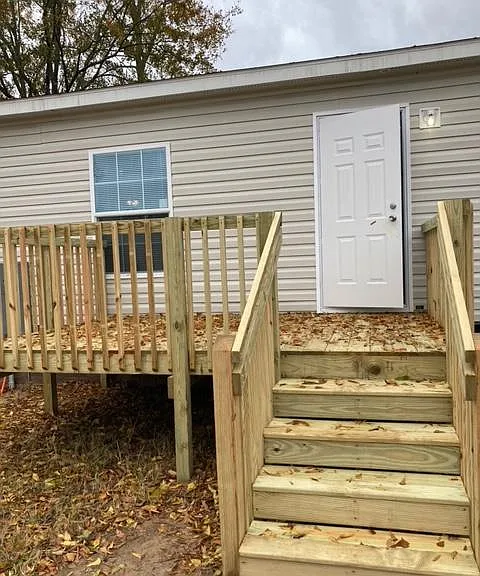 Back of home with back deck