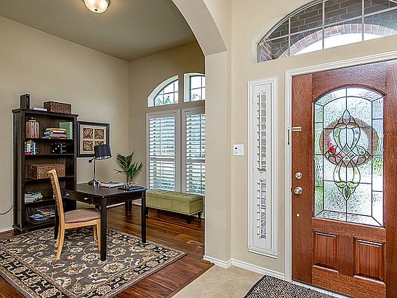 STUDY OFF ENTRY WITH ARCHED WALKWAYS & WOOD FLOORING ~