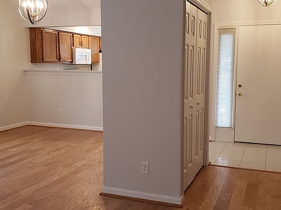 Entry door, and view of the dining area, coat closet.