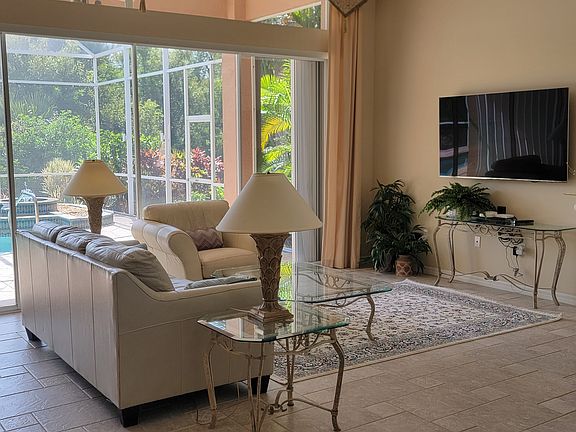 Everything about this home, from the soaring ceilings to the lighting and the backyard pool and forever wild, is meant to captivate your soul so you never want to leave!