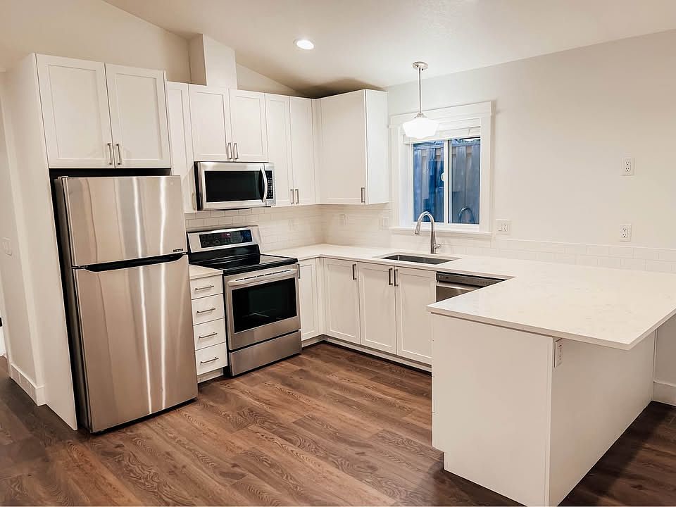 Full kitchen with clean, modern finishes_perfect for daily cooking or hosting with functional design to maximize storage and prep space.