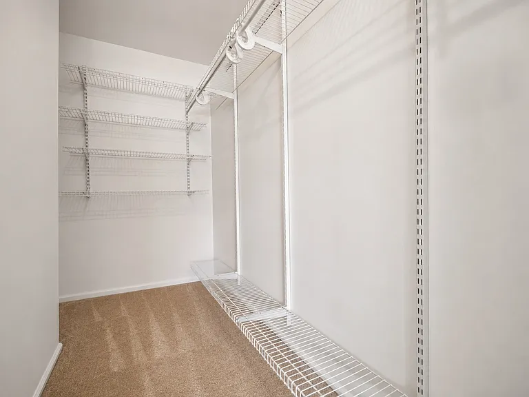 Primary Walk-in closet- Virtually enhanced