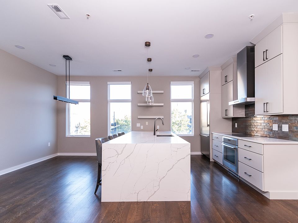 Chef''s kitchen features high-end Thermador appliances (purchased 2021), as well as a second oven/microwave/air fryer and brand new U-Line dual-temperature zone wine fridge. Bar stools included.