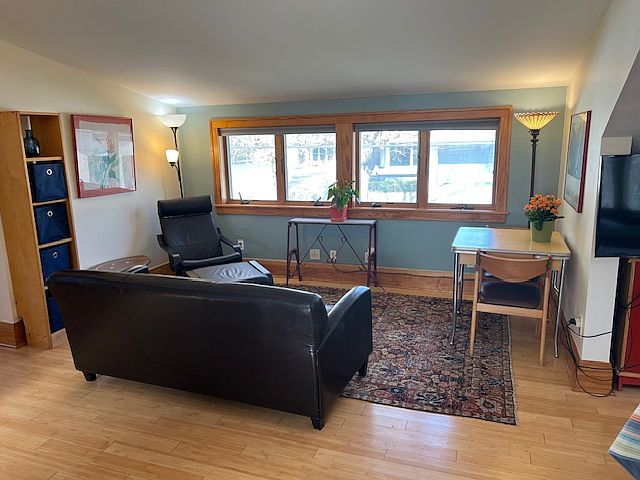 Comfortable furniture and good lighting. Living room windows face Lake Harriet