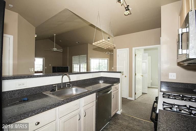Kitchen with Bar Open to Living&Dining Rooms