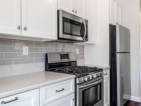 White cabinets with white granite countertops