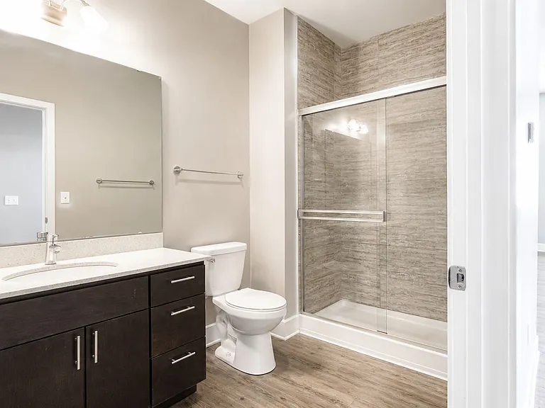 Elevate your living standards at Heer's Luxury Living. This modern bathroom features sleek finishes, spacious design, and a relaxing atmosphere. Embrace comfort and style daily. Explore your future home today!