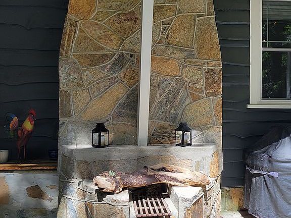 Backyard stone fireplace