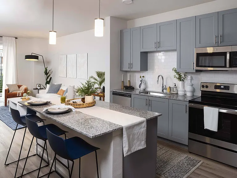 Prepare meals in a kitchen that combines modern design with practical functionality.