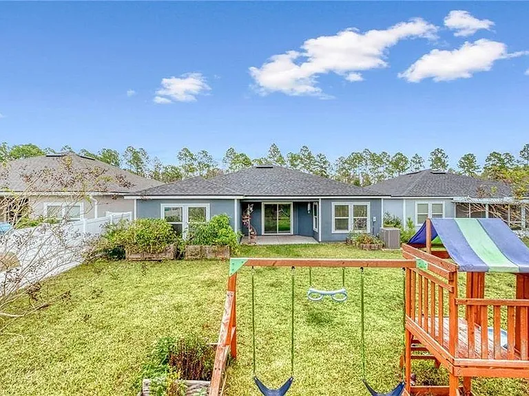 playset and kayaks not included. Two garden planters are included.