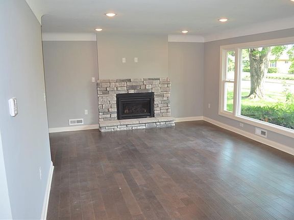 New Gas Fireplace with stone surround.