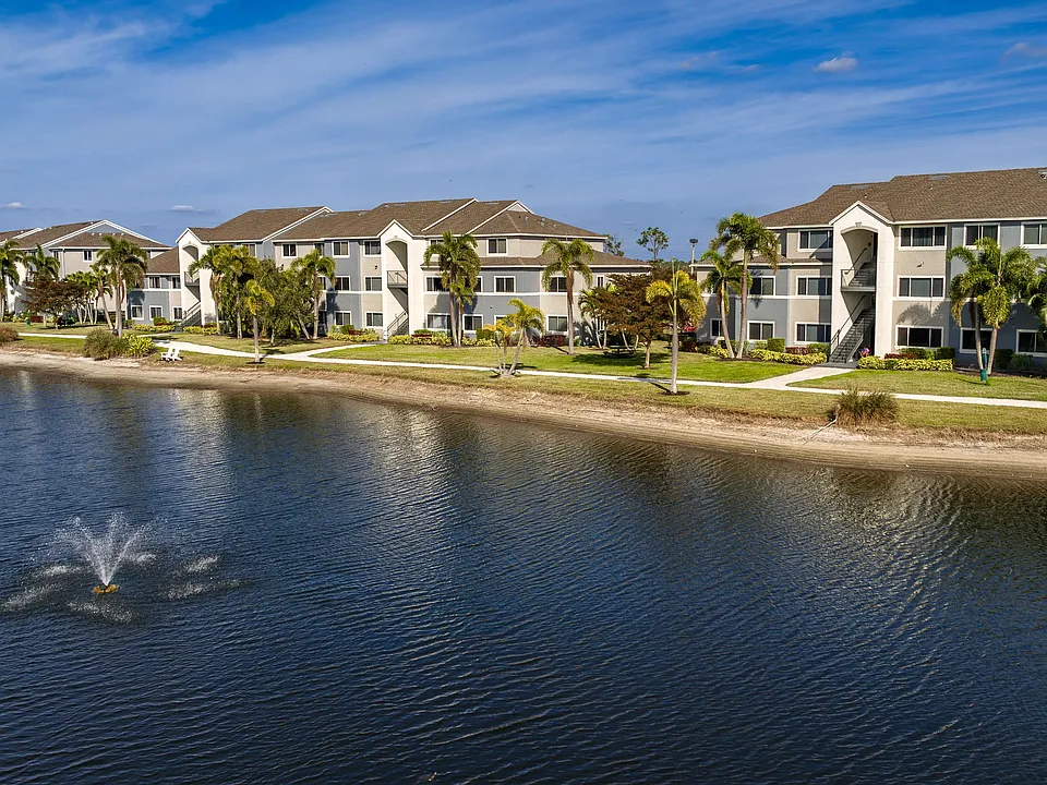 Discover the beauty of lakeside living at Lexington Palms, featuring stunning exteriors and a relaxing atmosphere.