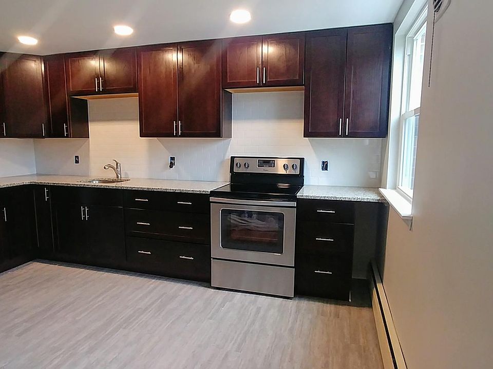 New cabinets, stainless appliances, subway tile backsplash and granite countertops.