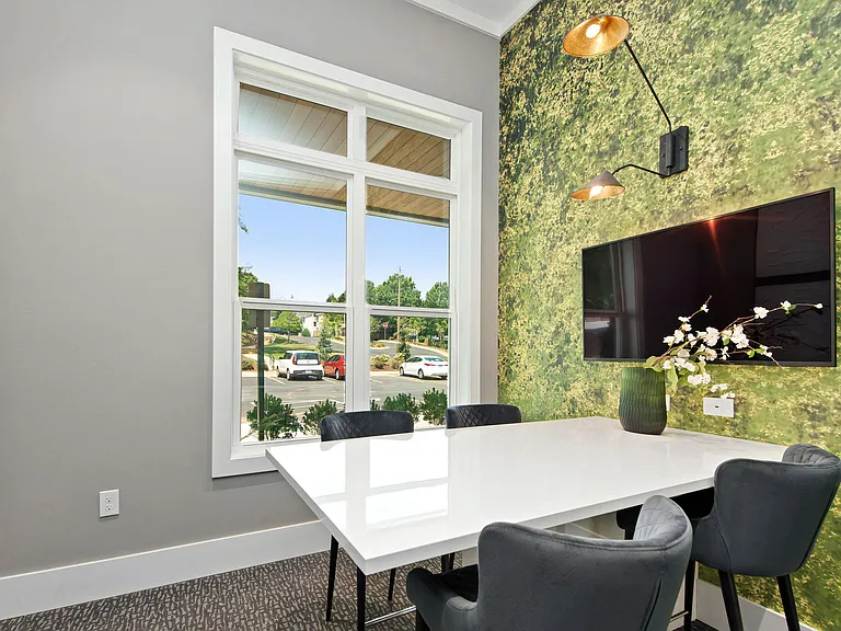 Private Conference Room with Wall-Mounted TV and Natural Light