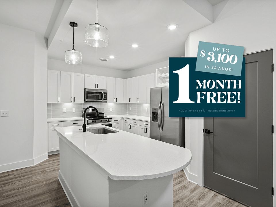 Kitchen with Quartz Countertop and Stainless Steel Appliances.