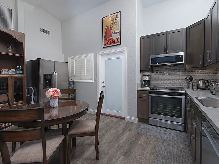 Full kitchen includes a dinning area with ample comfortable seating for four persons.