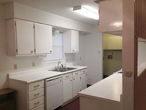Beautiful white cabinets and indoor/outdoor carpet