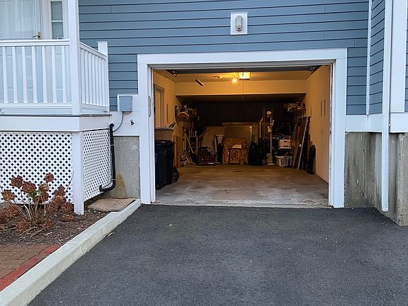 Attached, one car garage provides direct access to unit