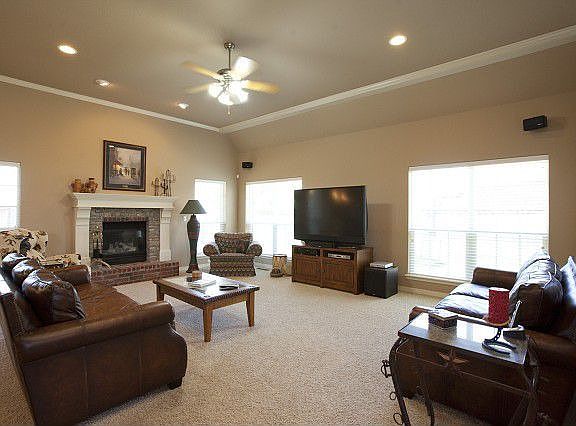Family room with stone and brick fireplace