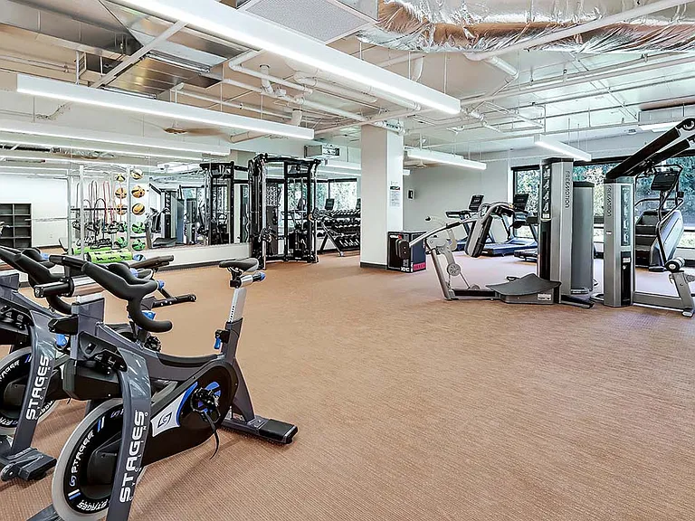 Griffis Shoreline fitness center with cardio machines and weight equipment.
