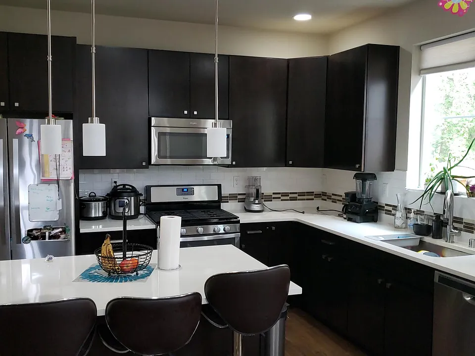 Open Kitchen with built-in island with beautiful stainless steel appliances