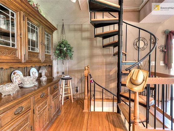 Spiral staircase opens into a huge loft area