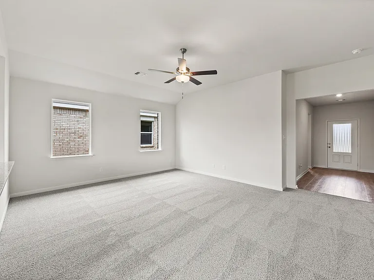The spacious family room is perfect for family living and hosting.