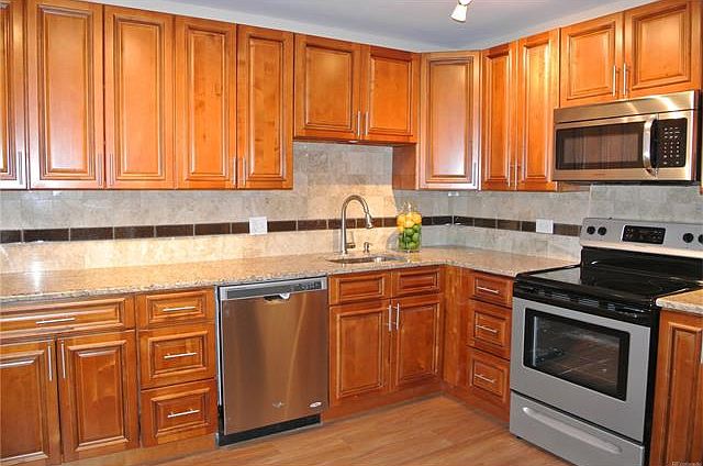 All wood Maple cabinets