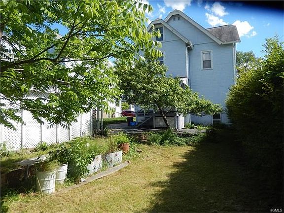 View of the back of the house from the large backyard.