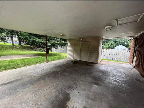 2 car garage/carport with 10 ft x 6 foot storage area for bikes! Outdoor patio area is perfect for a grill or chairs