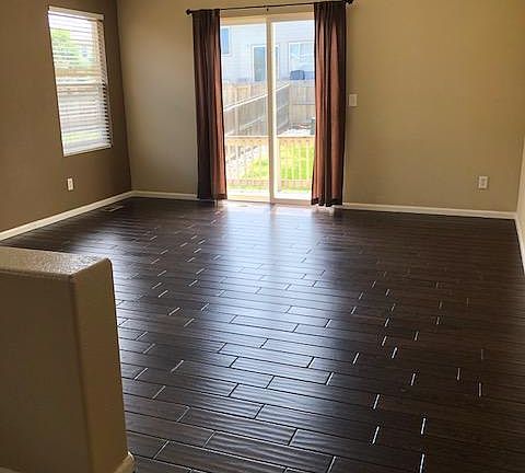 back living room with access to backyard/patio