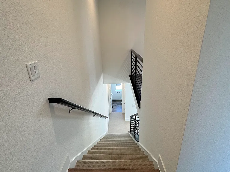 strairs from 3rd floor to living room area