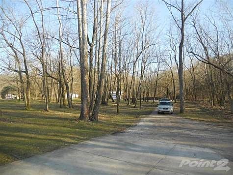 From the garage looking back at the road.  The white barn in the distance is the road.