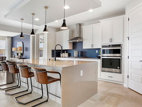 Enter the Parklane kitchen complete with a large waterfall island, ample storage space, and designer