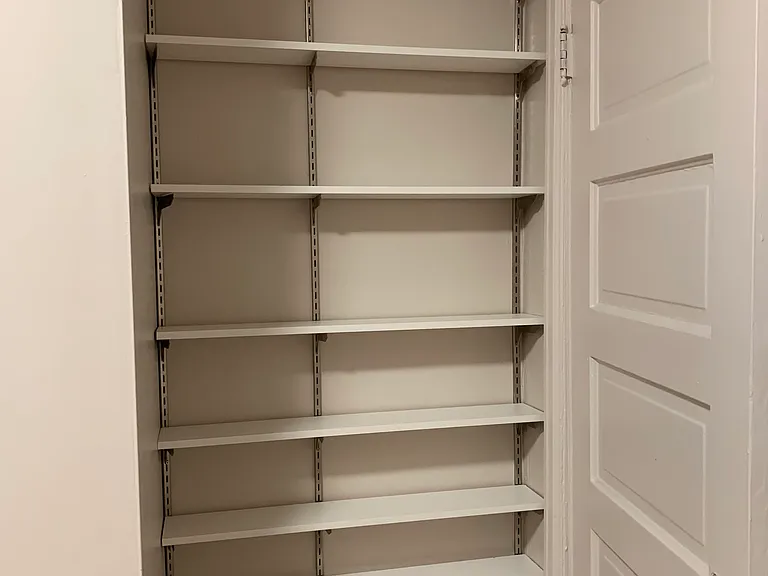 Additional shelving behind bedroom door